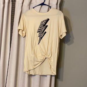 cream colored tshirt with a Lightning bolt on it